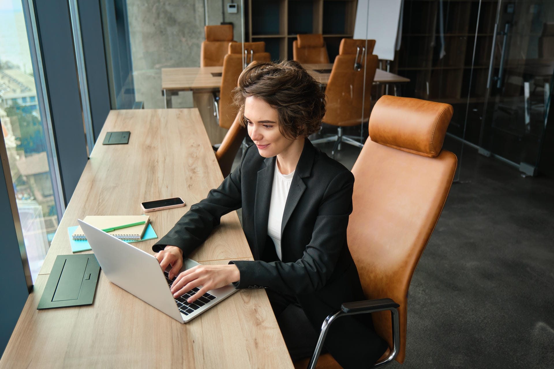 Consultant working at her desk in the office